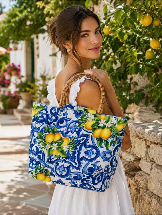 Boutique Handbags - NIP Lemon & blue tile print canvas
tote with Two bamboo like handles.
Gorgeous